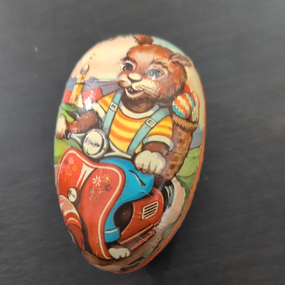 Vintage German Paper Mache Egg on Scooter